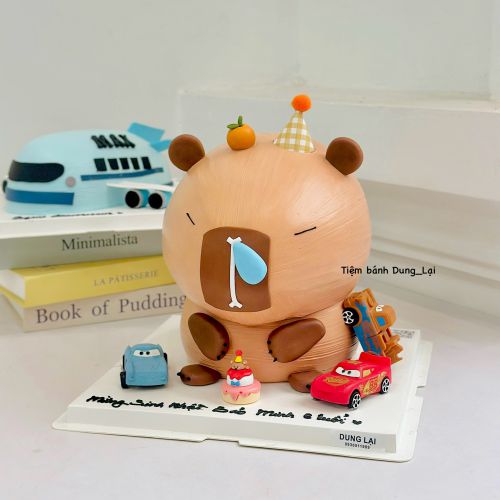 Bánh tạo hình capybara ô tô, Bánh Sinh Nhật Capybara, Bánh Sinh Nhật ô tô, Bánh Sinh Nhật bé trai, Bánh Sinh Nhật tạo hình - Bánh Sinh Nhật Long Biên